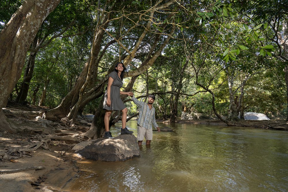 Couple exploring Kuruva Island during luxury stay in Wayanad